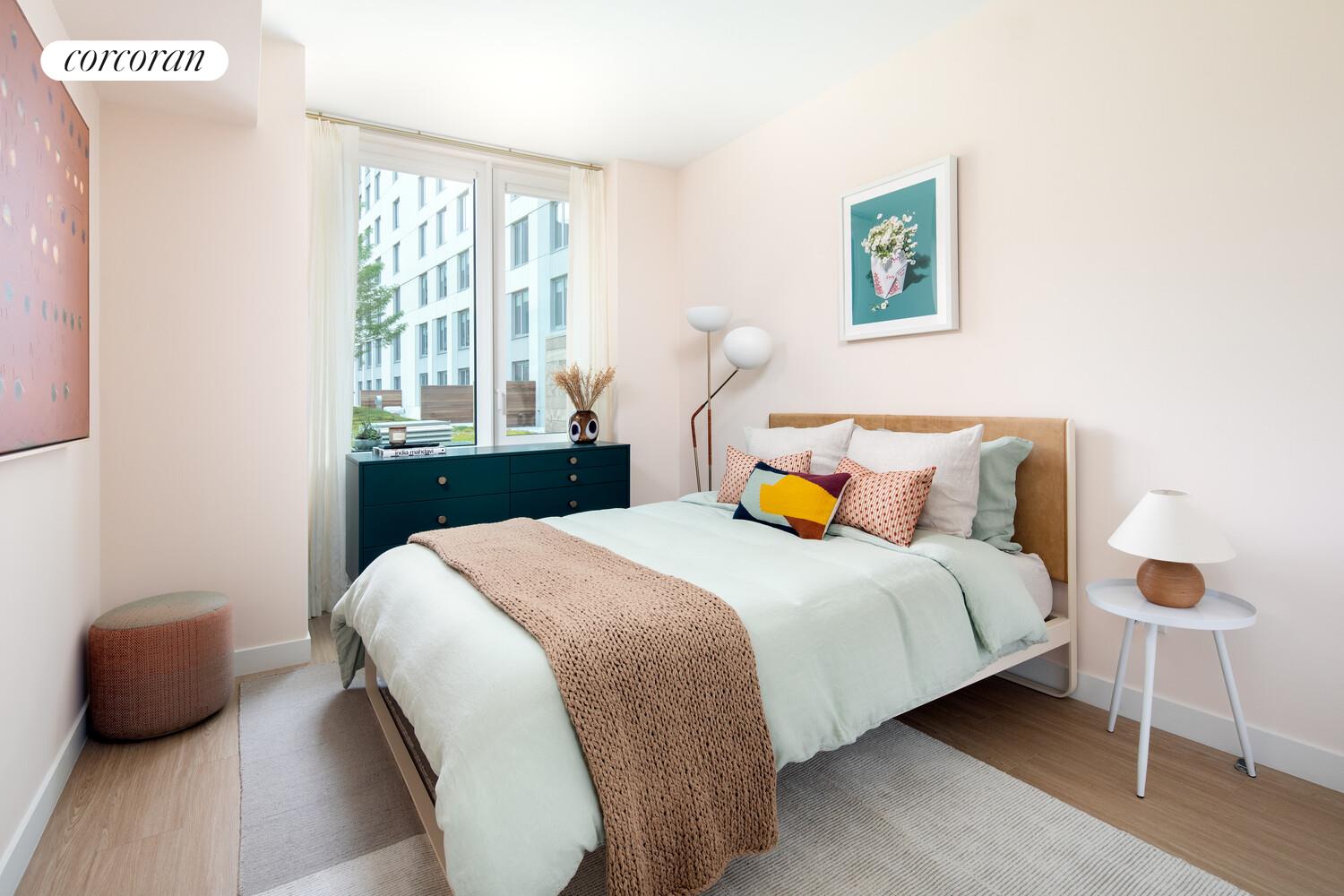 30-77 Vernon Boulevard, Unit 622W Queens, NY 11106 - Photo 5 of 8 a bedroom with a bed and a window