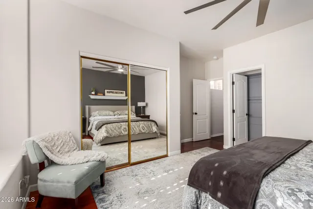 a bedroom with a bed and couch