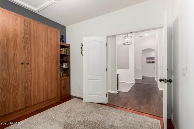 a bedroom with a bed and a shower