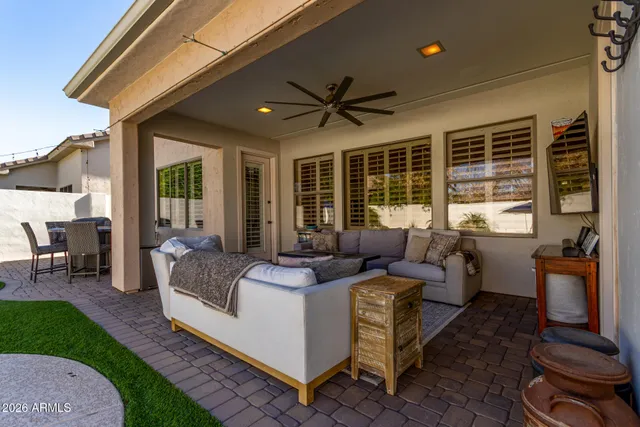 a view of a swimming pool with chair and tables