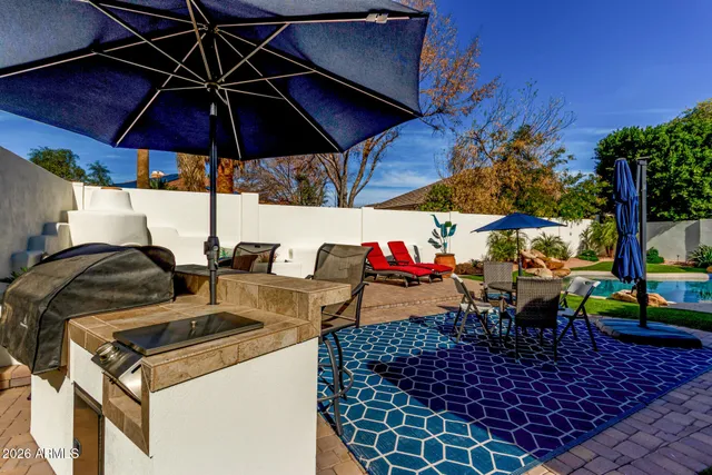 a view of a couches and dinning table in patio
