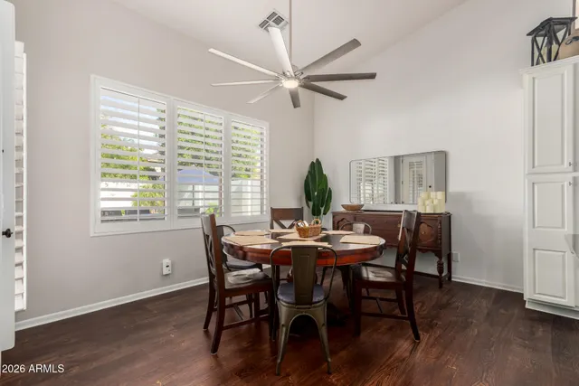 a view of a dining room with furniture window and wooden floor