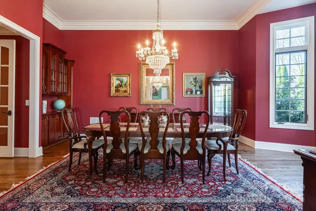 a view of a dining room with furniture and window