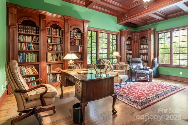 a living room with furniture a rug and a table