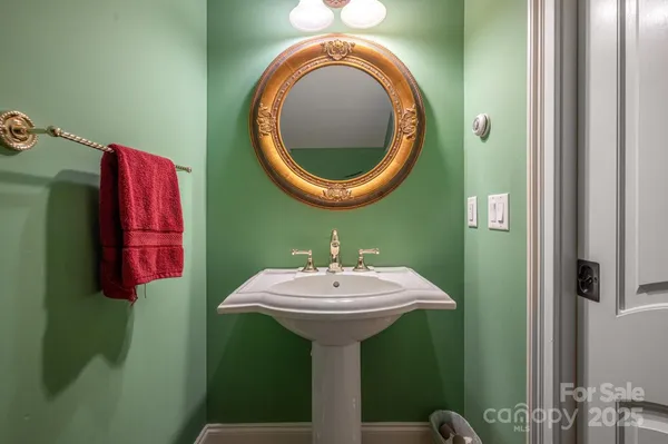a bathroom with a sink and mirror