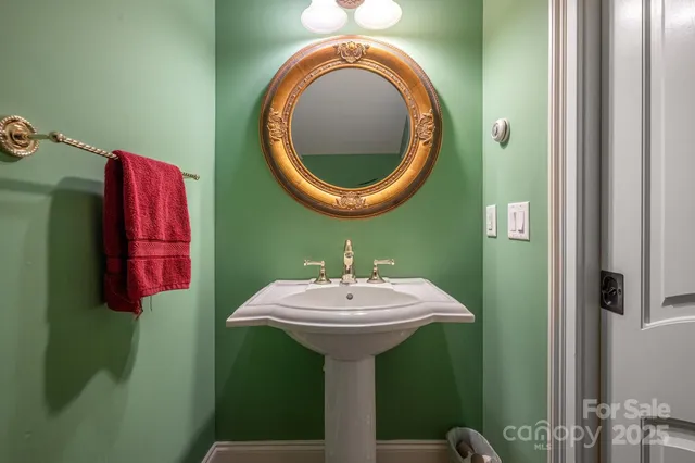 a bathroom with a sink and mirror