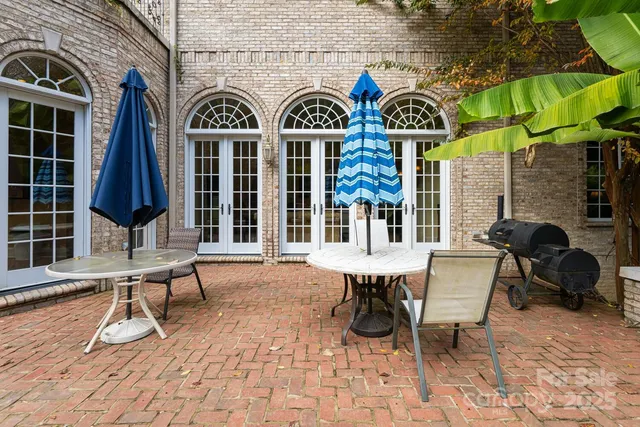 a view of a chairs and table in a patio