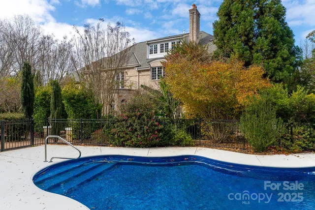 a view of swimming pool with a yard