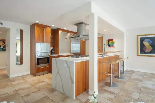 a kitchen with kitchen island cabinets and counter space