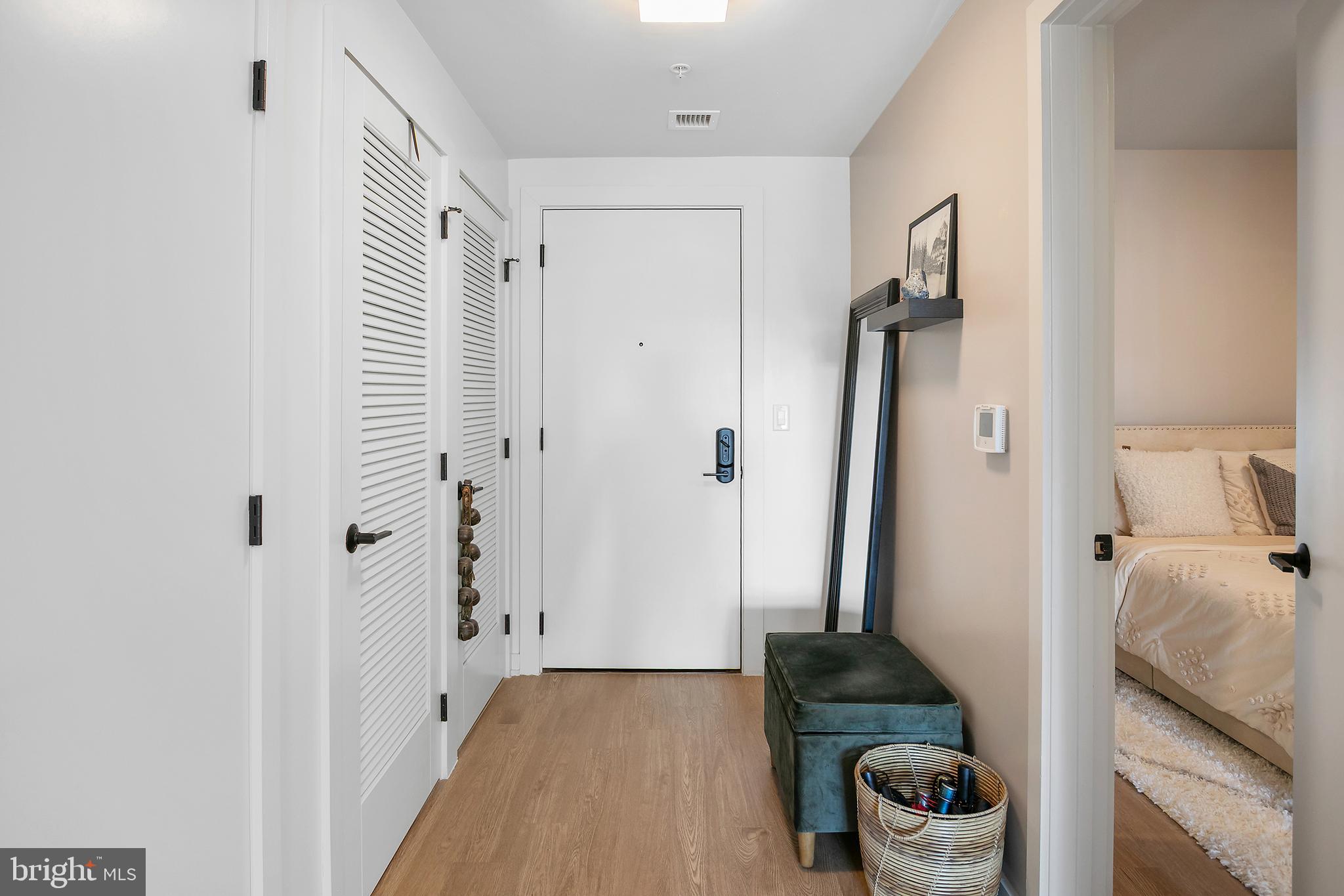 1625 Eckington Place Northeast, Unit 421 Washington, DC 20002 - Photo 20 of 40 a bedroom with a bed and a couch