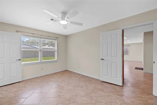a view of an empty room with a window