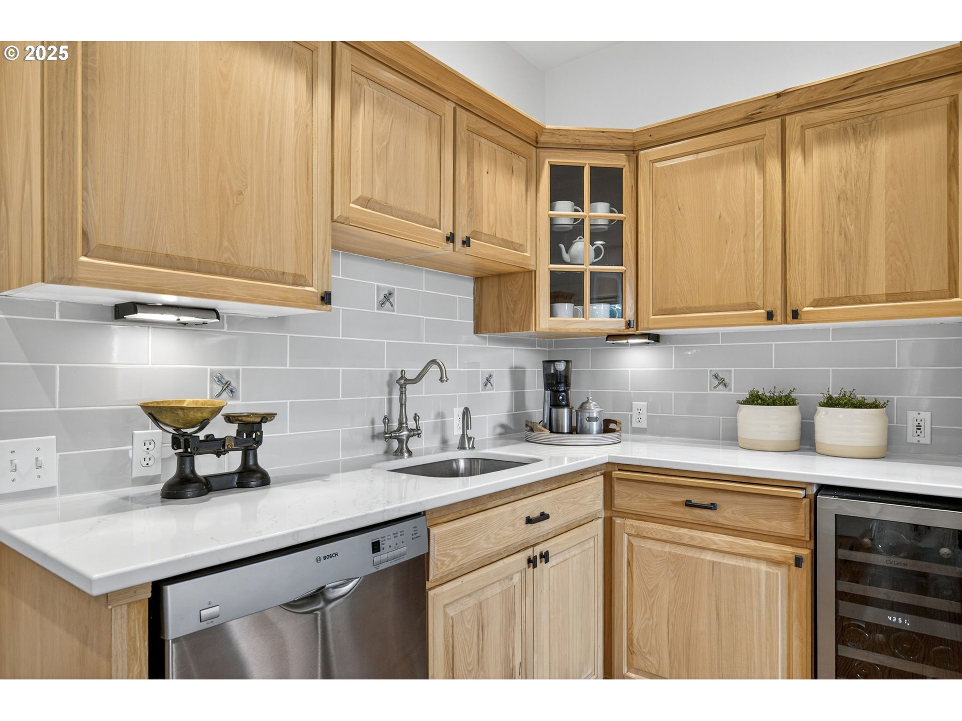 8452 Northwest Timber Ridge Court Portland, OR 97229 - Photo 17 of 48 a kitchen with stainless steel appliances granite countertop a sink a stove and cabinets
