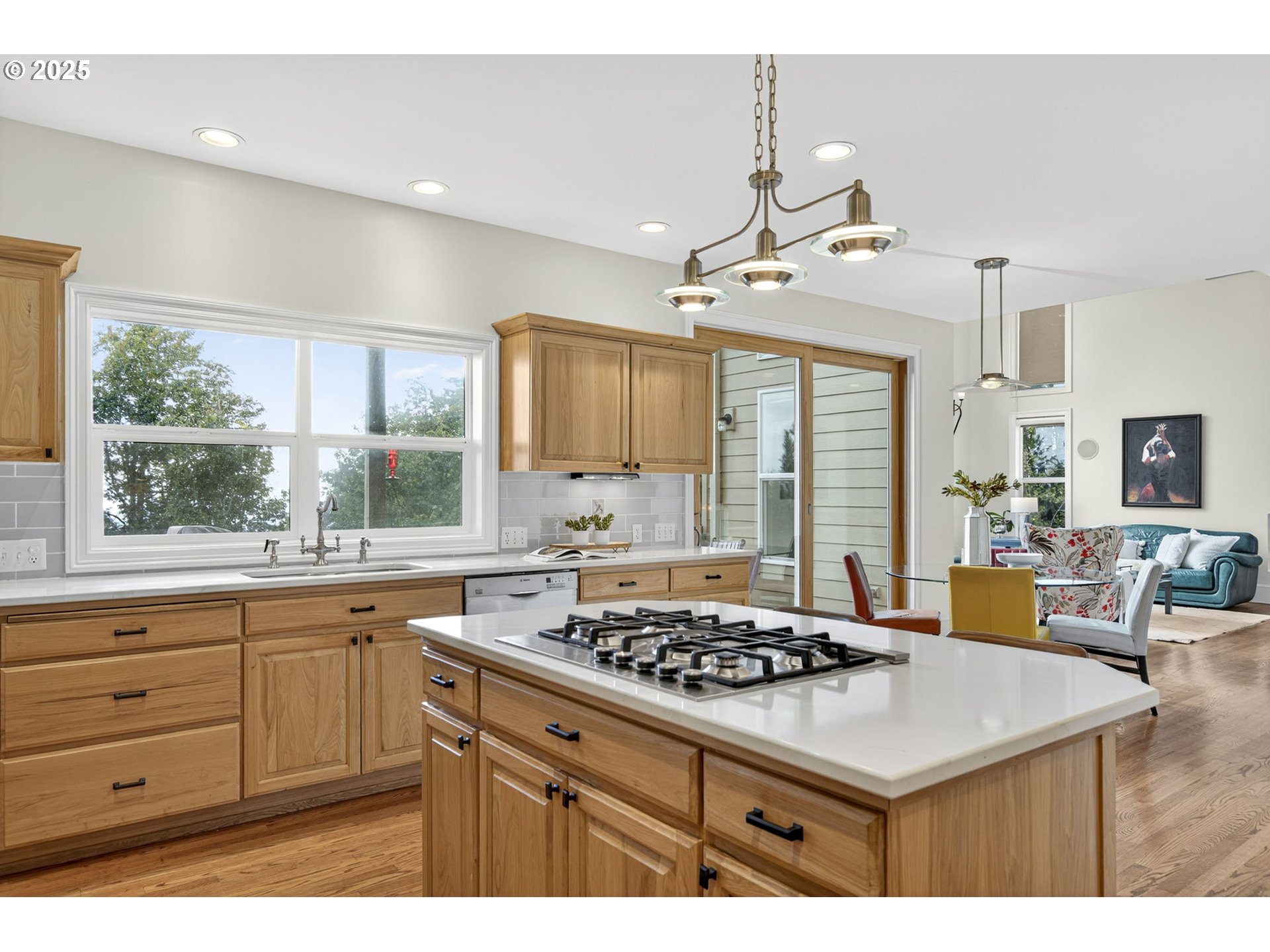 8452 Northwest Timber Ridge Court Portland, OR 97229 - Photo 18 of 48 a kitchen with a stove a sink a window and dining table