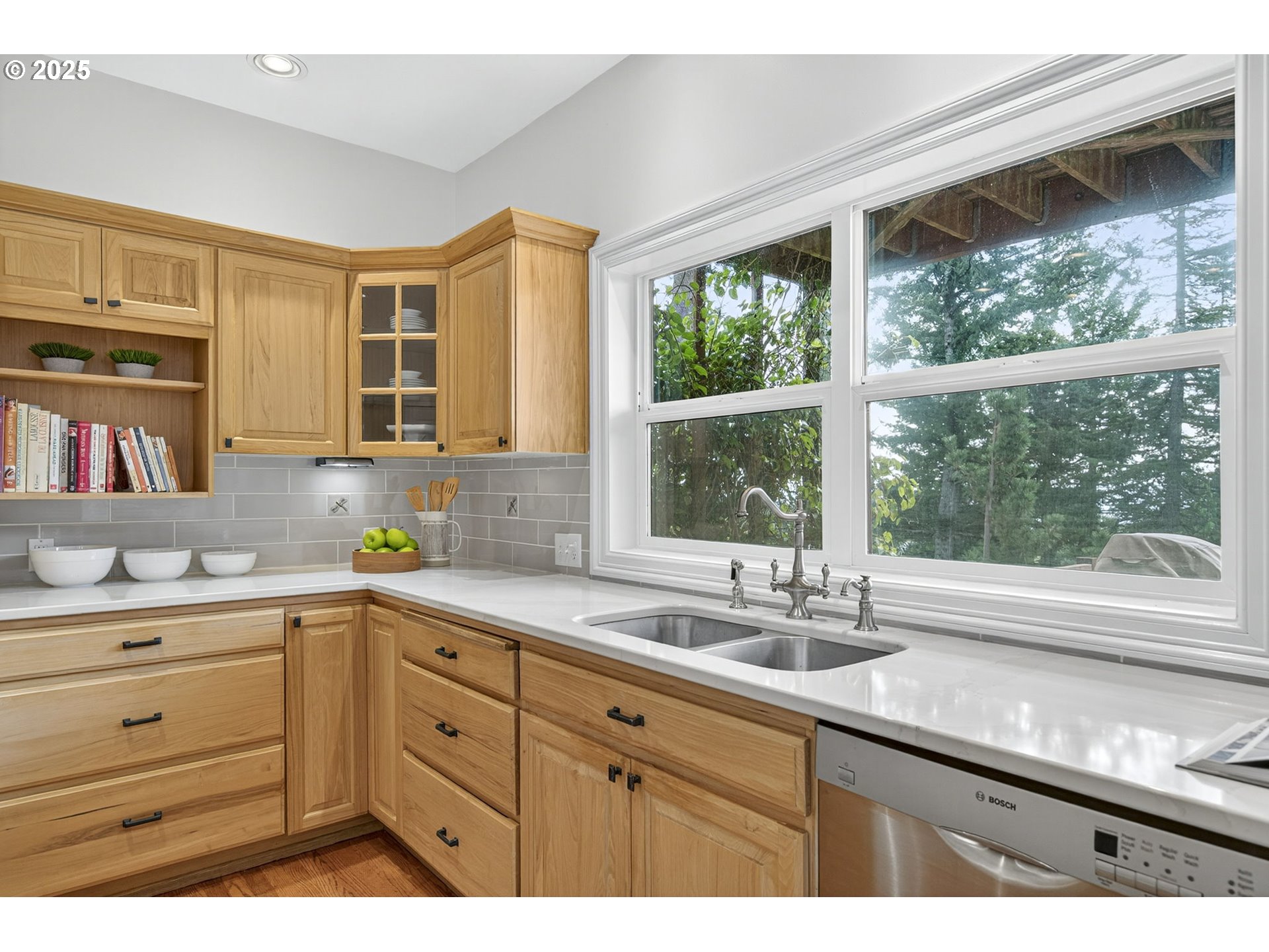 8452 Northwest Timber Ridge Court Portland, OR 97229 - Photo 19 of 48 a kitchen with a sink and large window