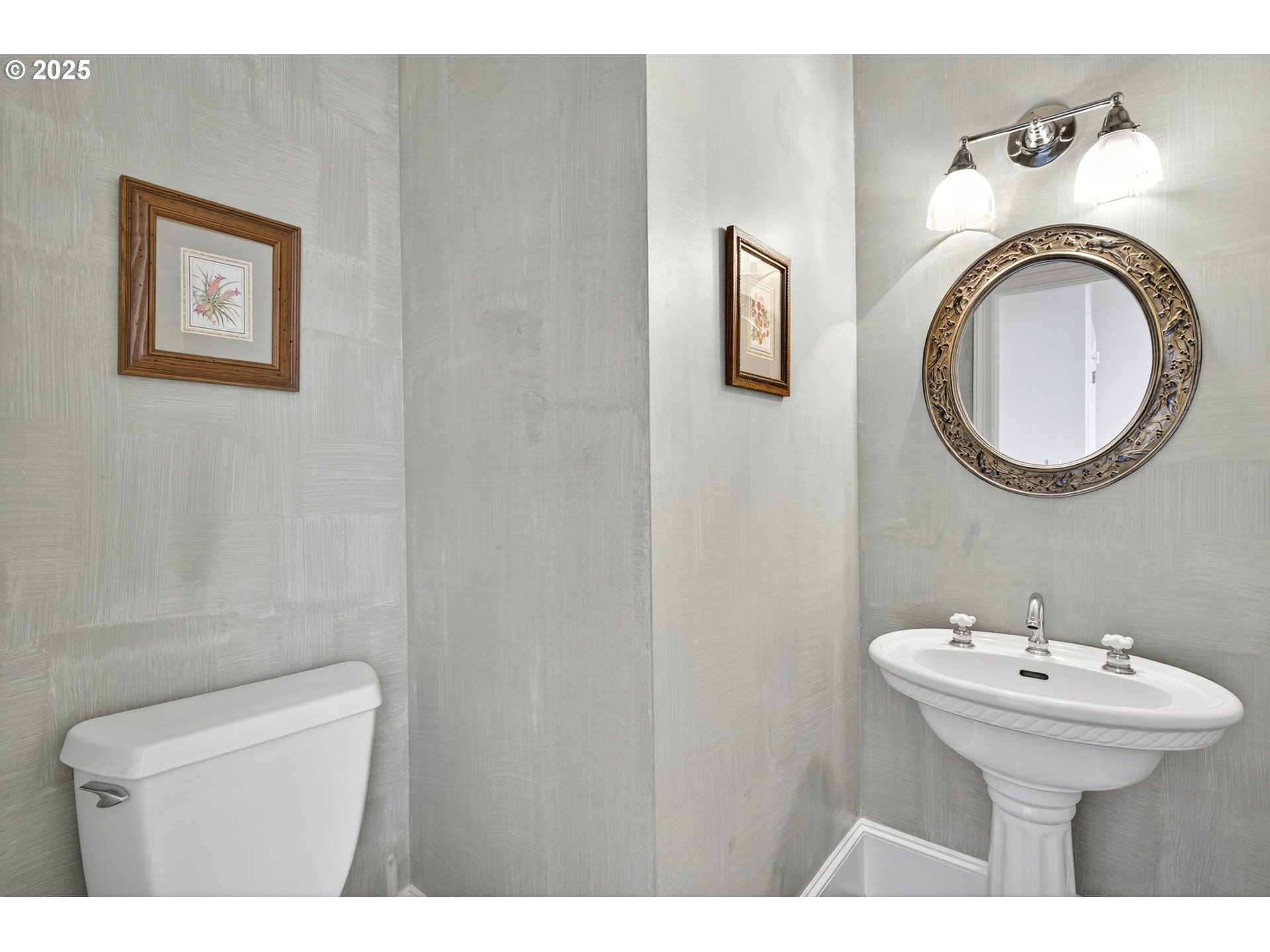 8452 Northwest Timber Ridge Court Portland, OR 97229 - Photo 22 of 48 a bathroom with a toilet sink and mirror