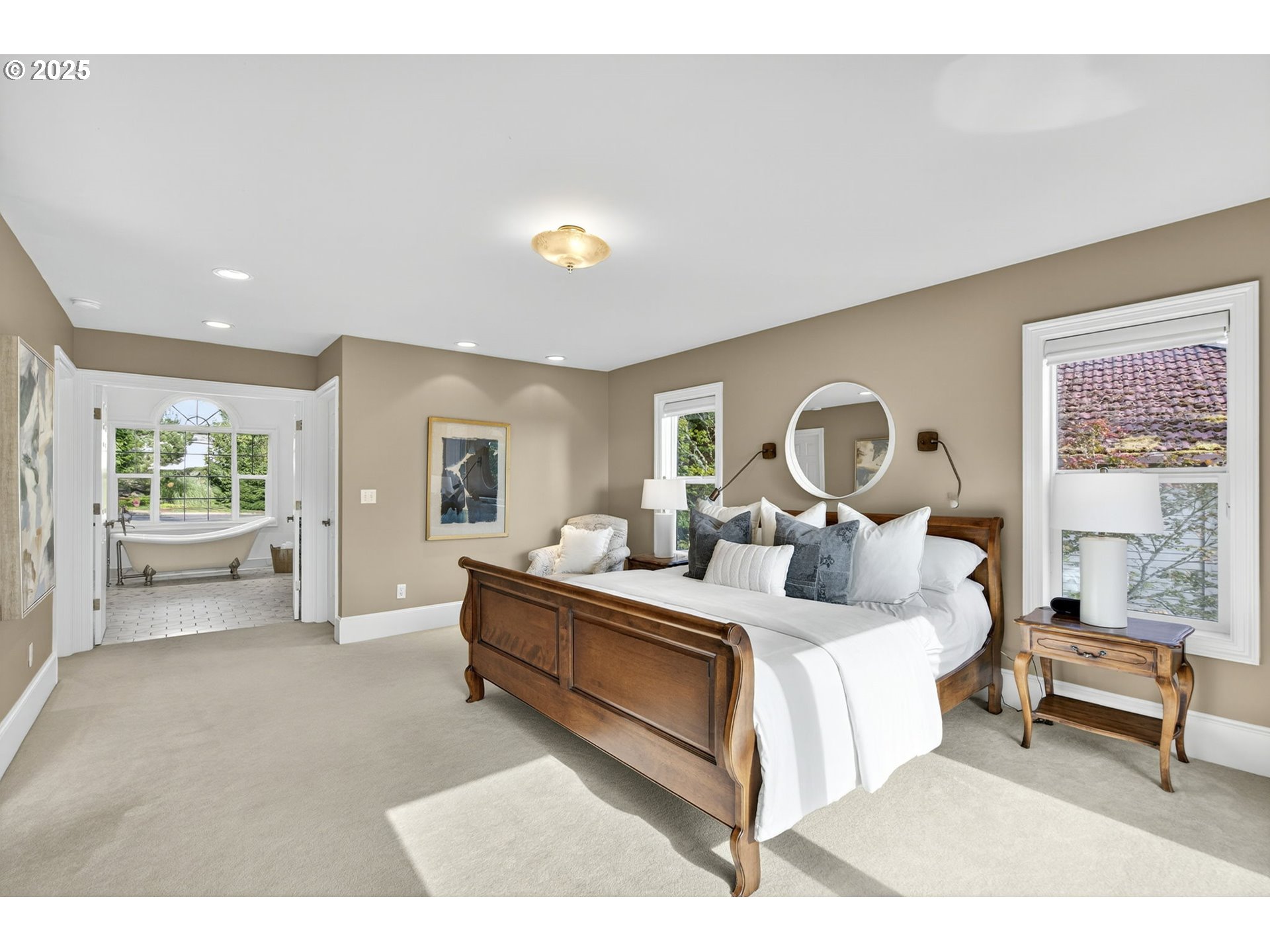 8452 Northwest Timber Ridge Court Portland, OR 97229 - Photo 24 of 48 a bed room with a bed and a lamp
