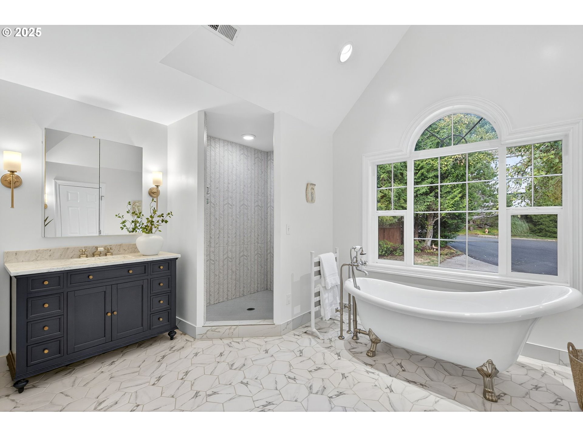 8452 Northwest Timber Ridge Court Portland, OR 97229 - Photo 26 of 48 a bathroom with a tub sink and mirror