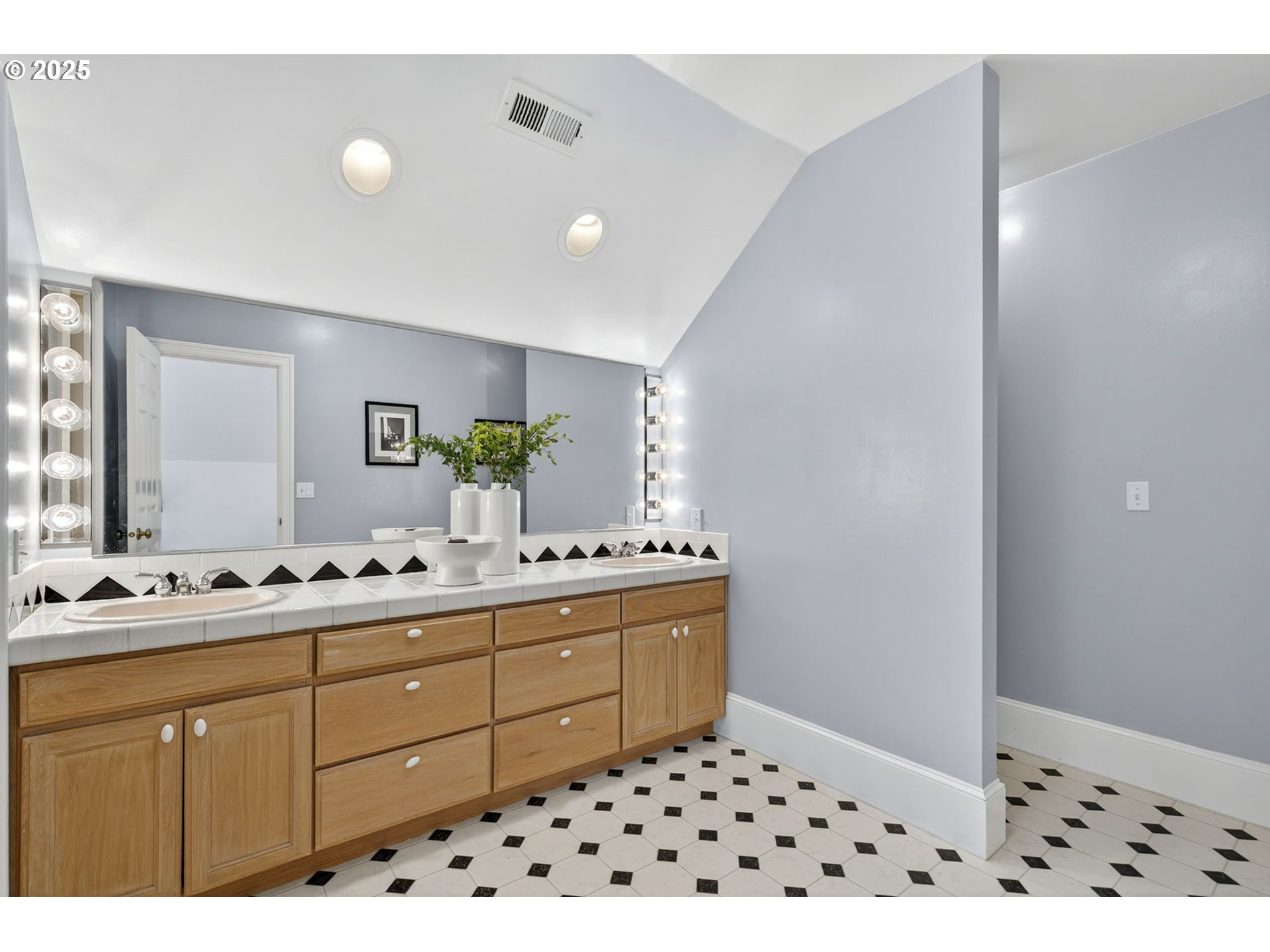 8452 Northwest Timber Ridge Court Portland, OR 97229 - Photo 38 of 48 a room with a sink a mirror and a shower