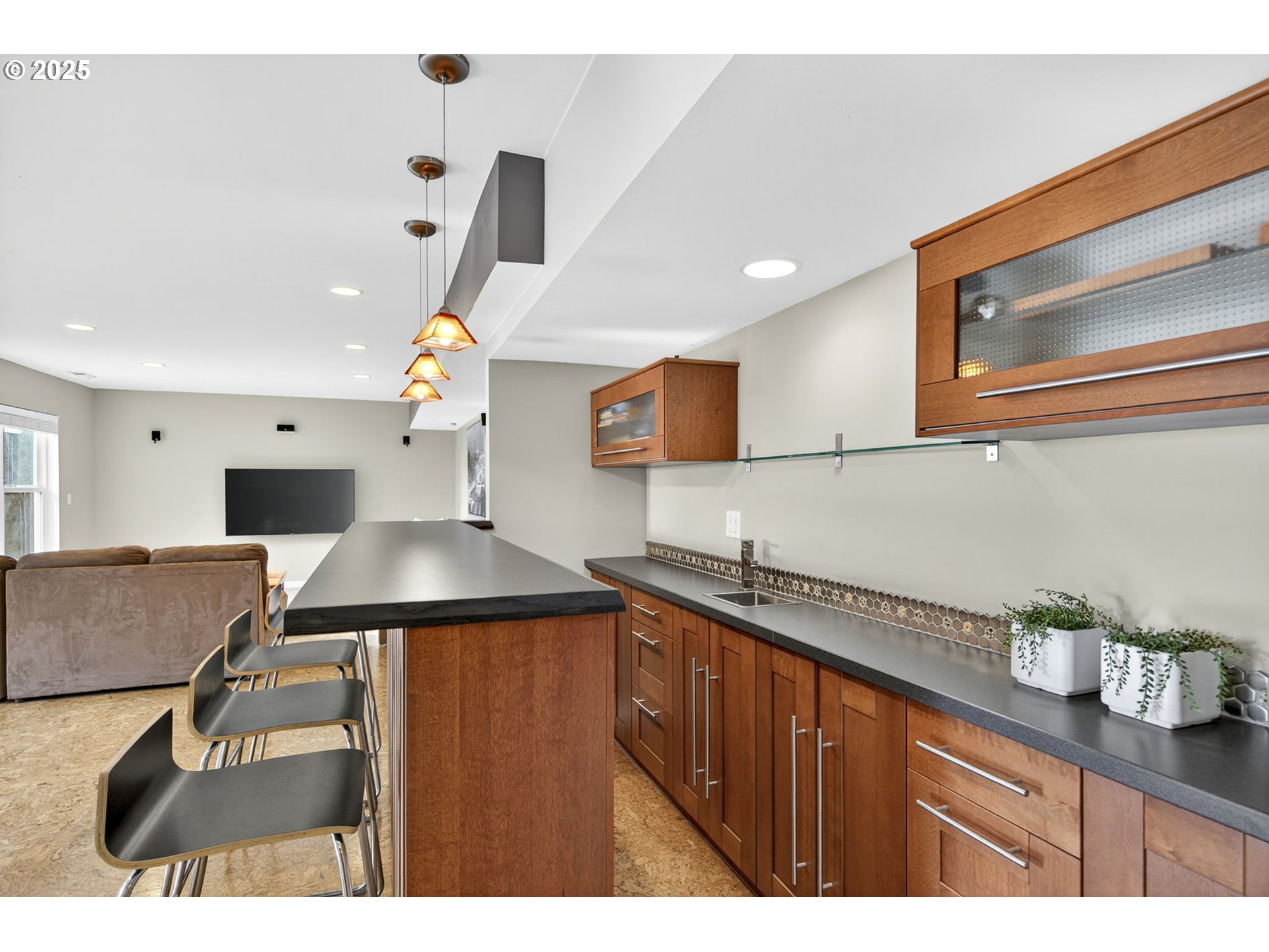 8452 Northwest Timber Ridge Court Portland, OR 97229 - Photo 41 of 48 a kitchen with stainless steel appliances granite countertop a sink a stove and a wooden cabinets