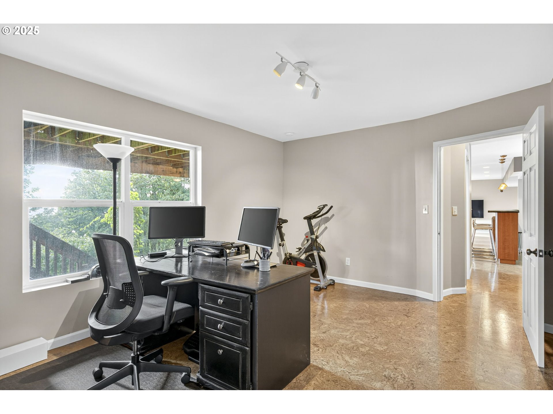 8452 Northwest Timber Ridge Court Portland, OR 97229 - Photo 43 of 48 a view of a workspace with furniture and a window