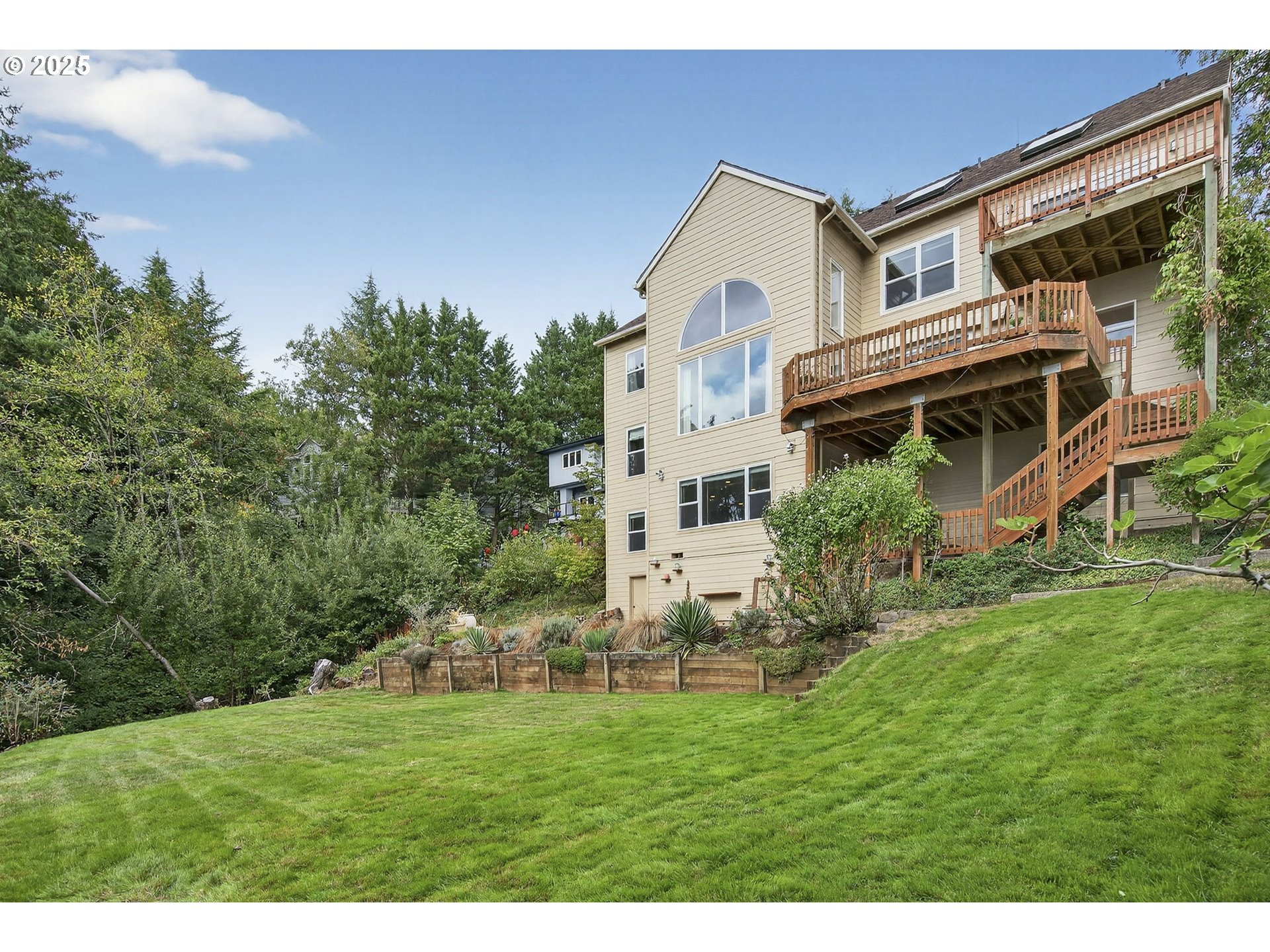 8452 Northwest Timber Ridge Court Portland, OR 97229 - Photo 46 of 48 a front view of a house with a yard