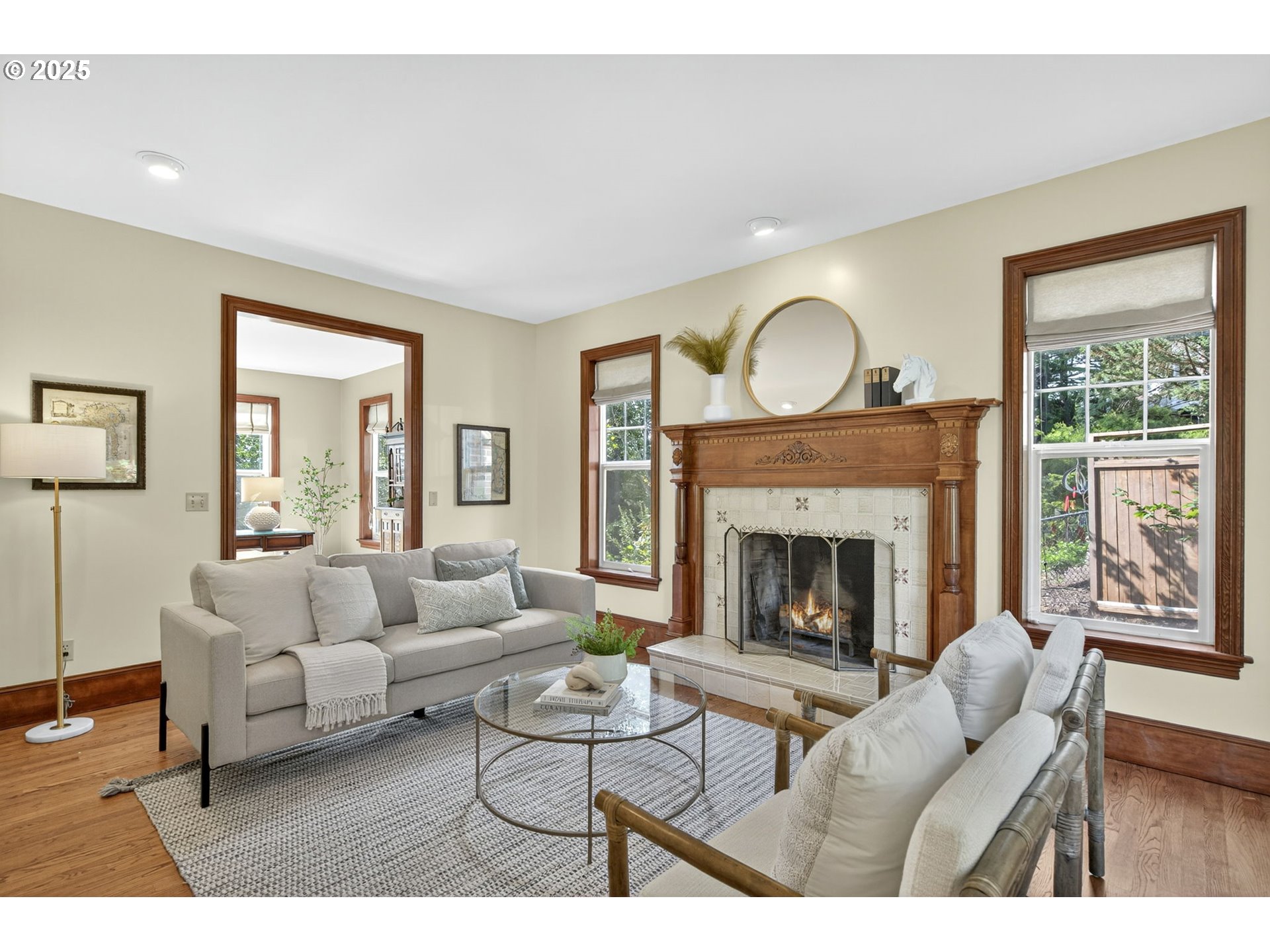 8452 Northwest Timber Ridge Court Portland, OR 97229 - Photo 7 of 48 a living room with furniture a window and a fireplace