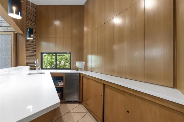a view of a livingroom with furniture and a window