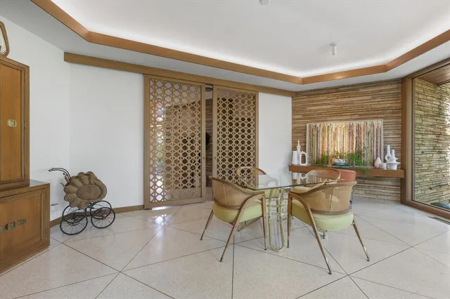 a kitchen with stainless steel appliances granite countertop a sink and a refrigerator