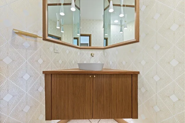 a bathroom with a shower and a sink