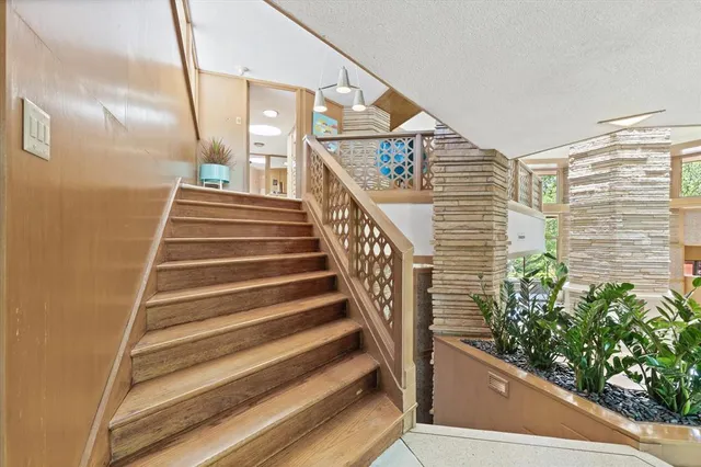 a balcony with furniture and a chandelier