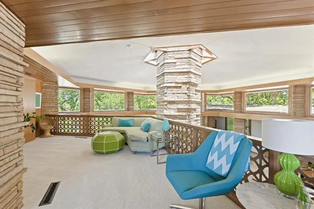 a view of a chairs and table in a patio