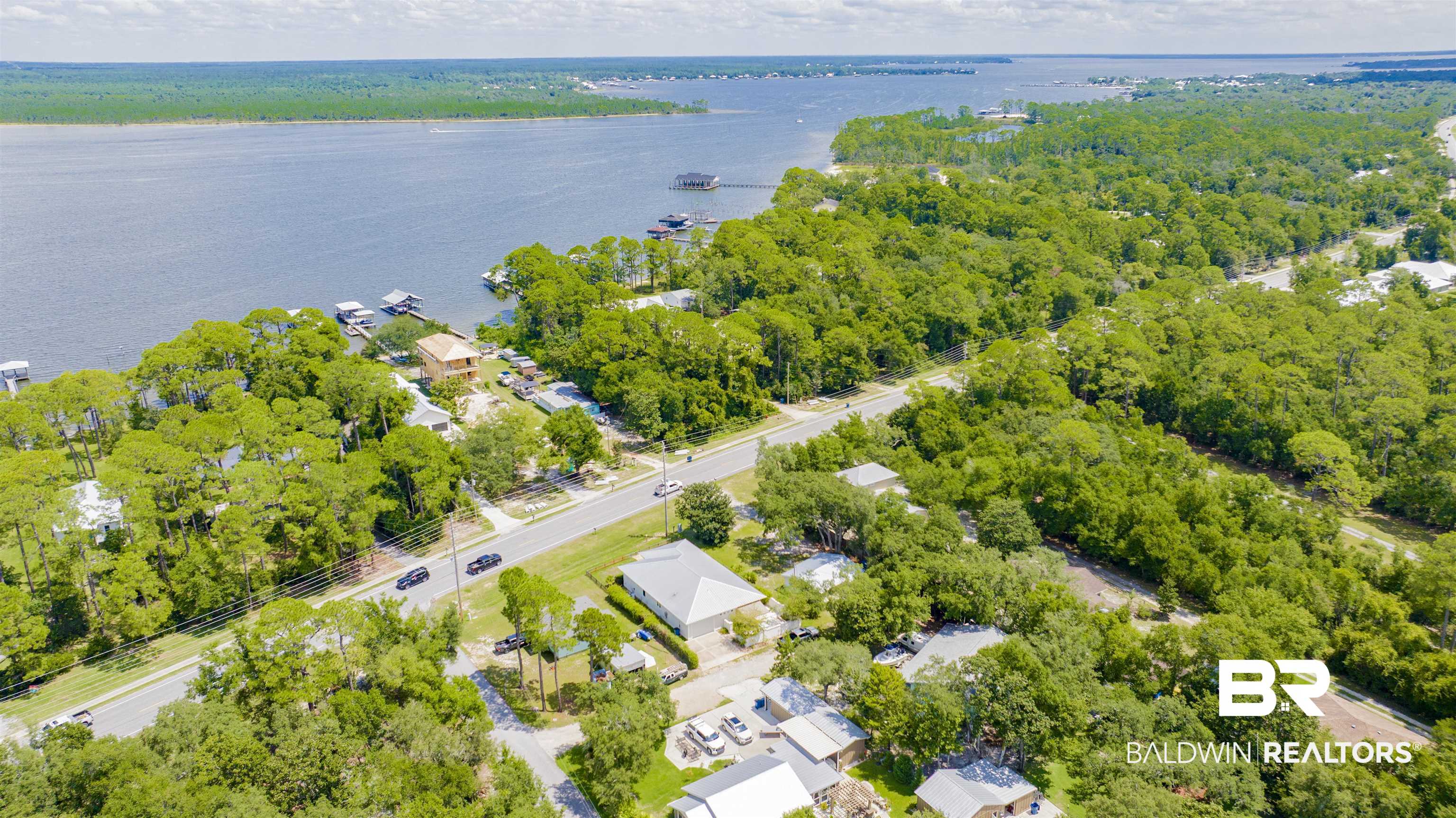 27980 Canal Road Orange Beach, AL 36561 - Photo 45 of 46 Aerial perspective of suburban area with a large body of water
