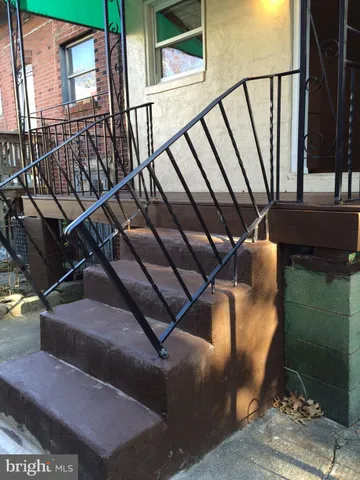 a view of a balcony with chairs