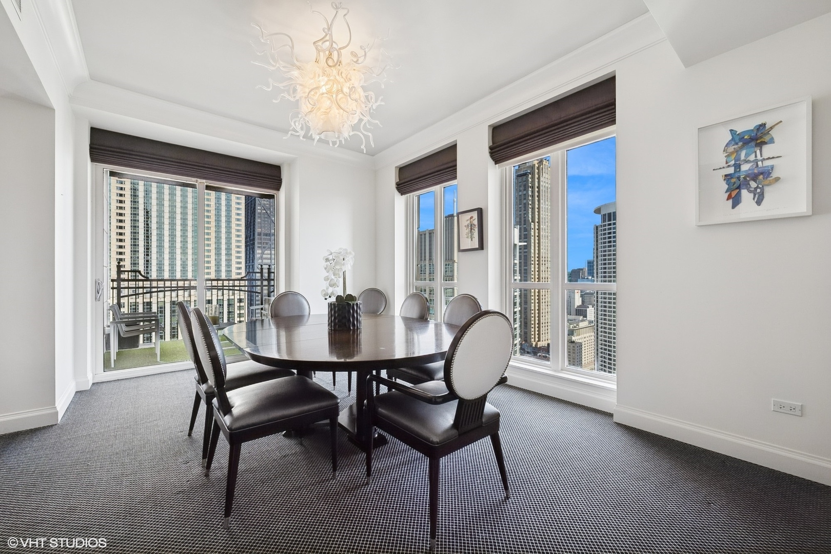 11 East Walton Street, Unit 4101 Chicago, IL 60611 - Photo 12 of 45 a view of a dining room with furniture and a potted plant