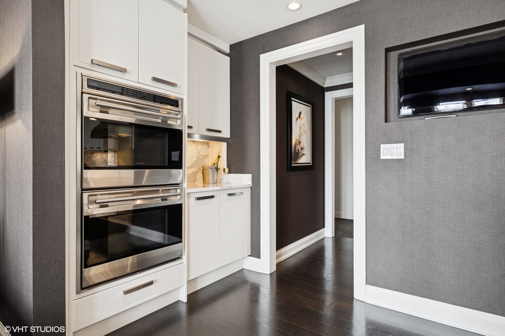 11 East Walton Street, Unit 4101 Chicago, IL 60611 - Photo 17 of 45 a kitchen with granite countertop a stove and a microwave