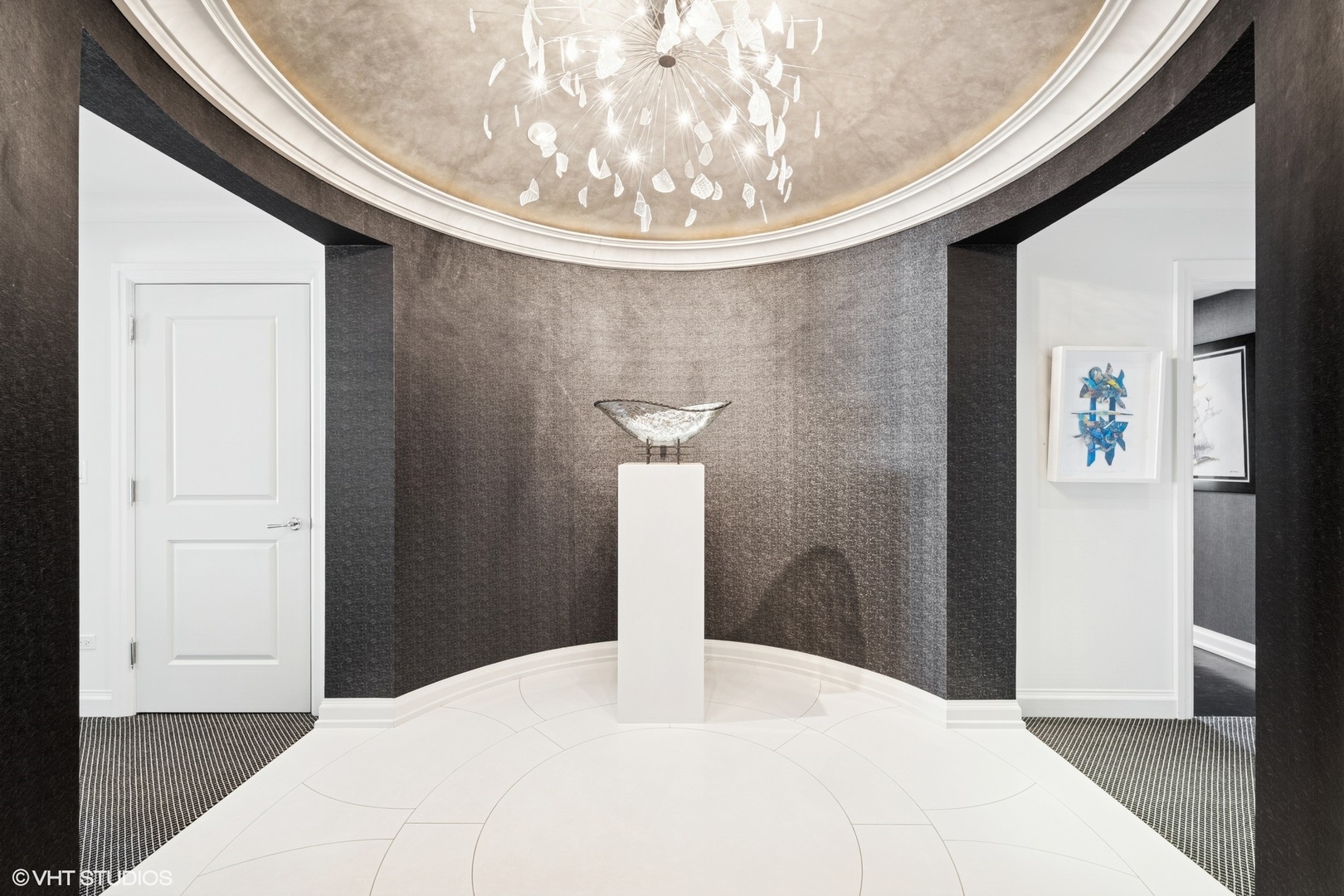 11 East Walton Street, Unit 4101 Chicago, IL 60611 - Photo 2 of 45 a bedroom with a bed and a chandelier