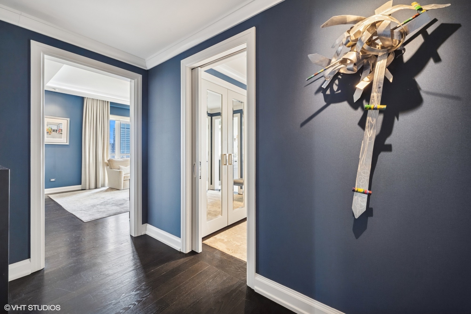 11 East Walton Street, Unit 4101 Chicago, IL 60611 - Photo 24 of 45 a view of a hallway to a bedroom with wooden floor and stairs