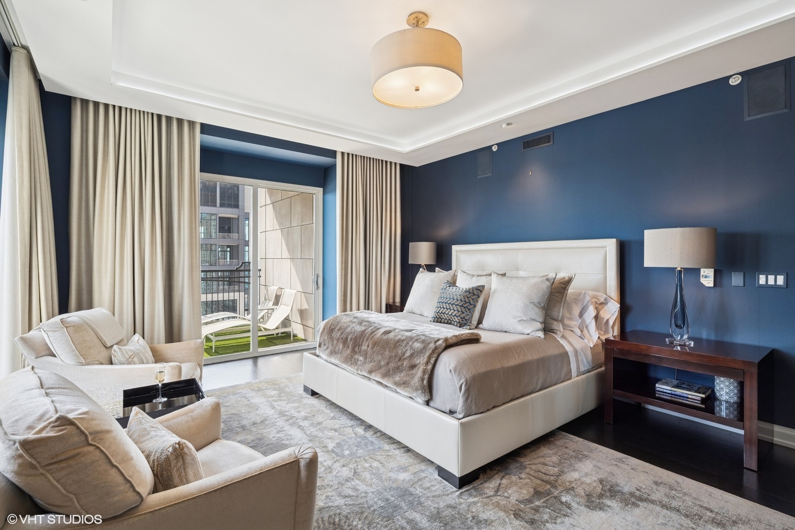 11 East Walton Street, Unit 4101 Chicago, IL 60611 - Photo 26 of 45 a bedroom with a bed and a couch