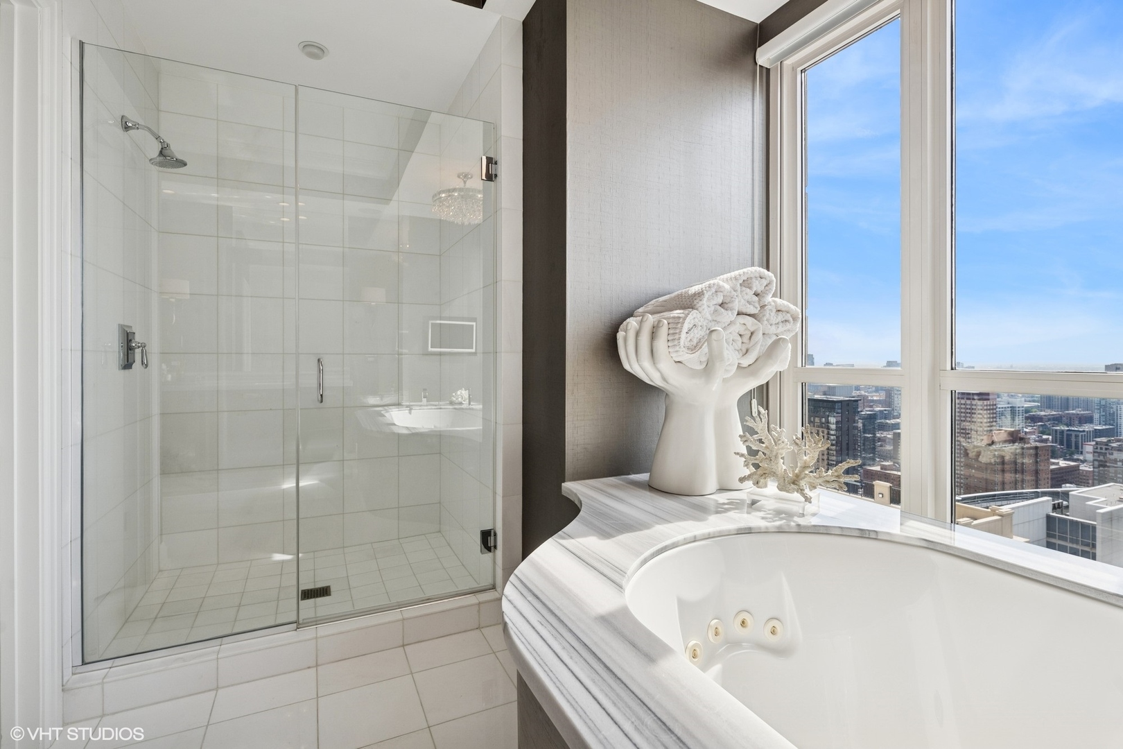 11 East Walton Street, Unit 4101 Chicago, IL 60611 - Photo 32 of 45 a bathroom with a tub shower and sink