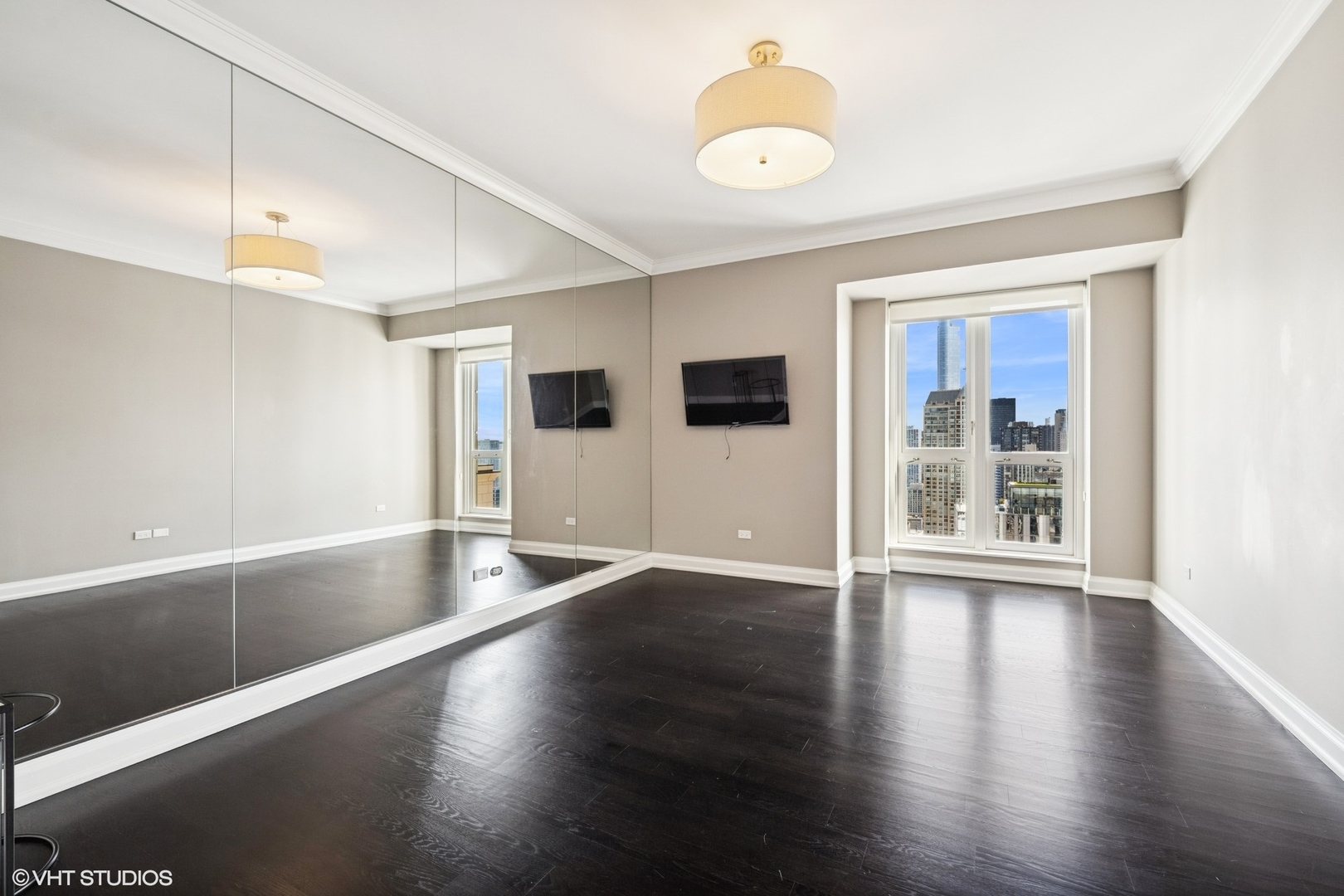 11 East Walton Street, Unit 4101 Chicago, IL 60611 - Photo 37 of 45 a view of an empty room with wooden floor and a window