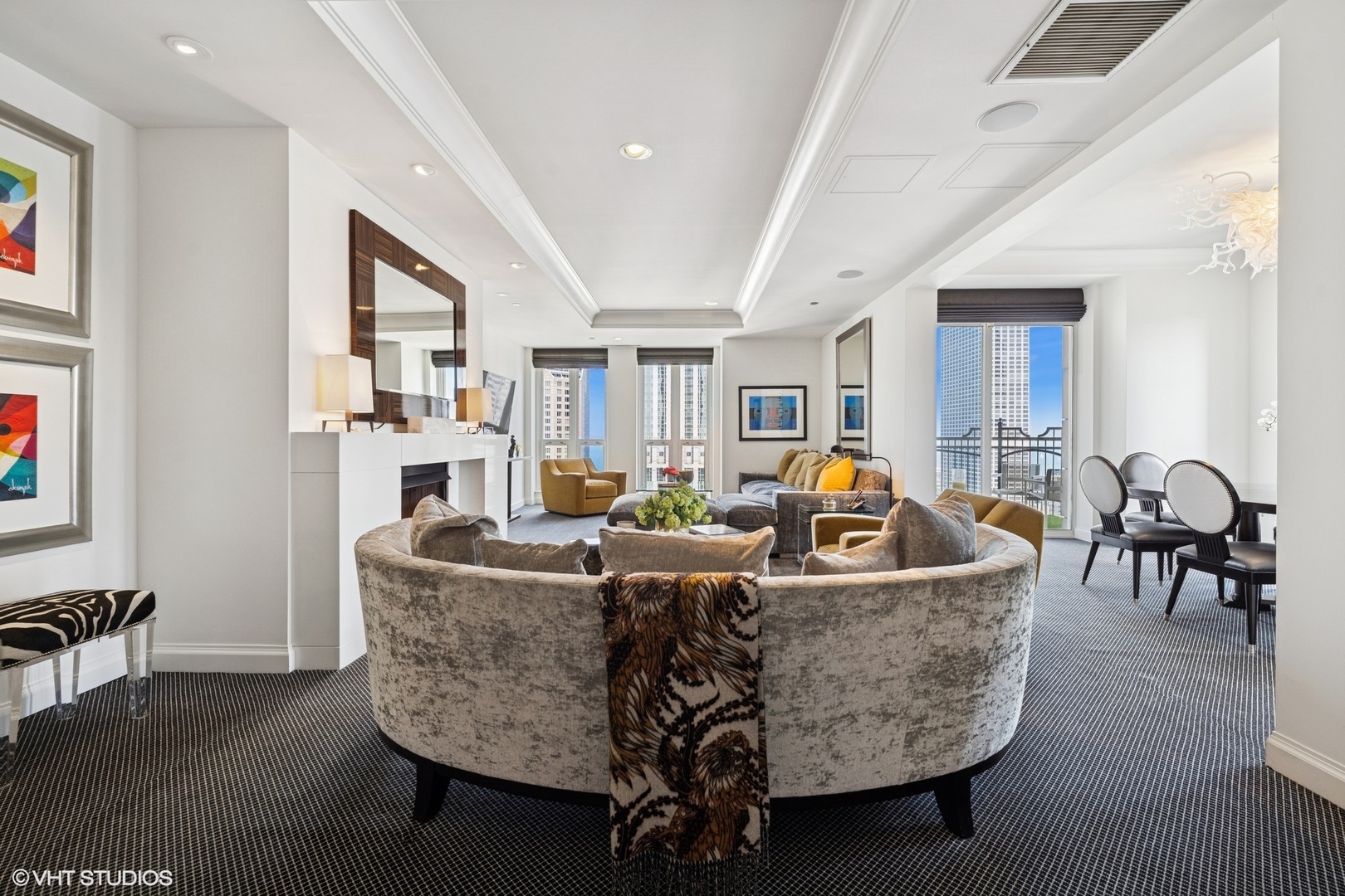 11 East Walton Street, Unit 4101 Chicago, IL 60611 - Photo 4 of 45 a living room with furniture a dining table and chairs with wooden floor