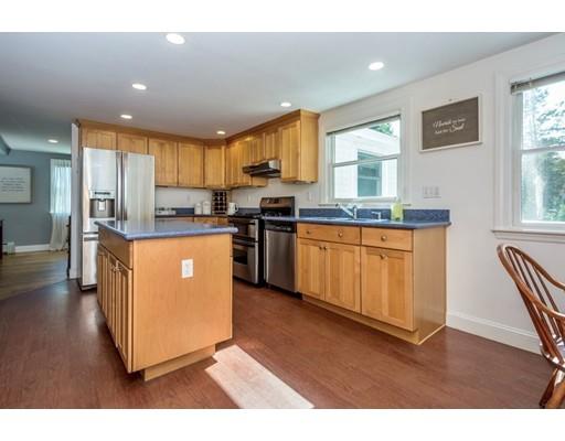 68 Harding Road Lexington, MA 02420 - Photo 14 of 41 a kitchen with stainless steel appliances granite countertop a stove top oven a sink a refrigerator with white cabinets and wooden floor