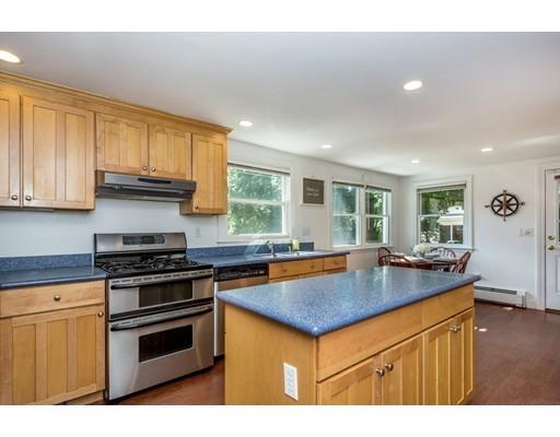 68 Harding Road Lexington, MA 02420 - Photo 16 of 41 a kitchen with stainless steel appliances granite countertop a sink stove and refrigerator