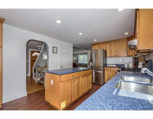 68 Harding Road Lexington, MA 02420 - Photo 17 of 41 a kitchen with stainless steel appliances granite countertop a sink and a refrigerator