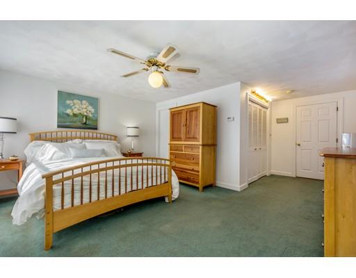 68 Harding Road Lexington, MA 02420 - Photo 21 of 41 a bedroom with a bed and a chandelier