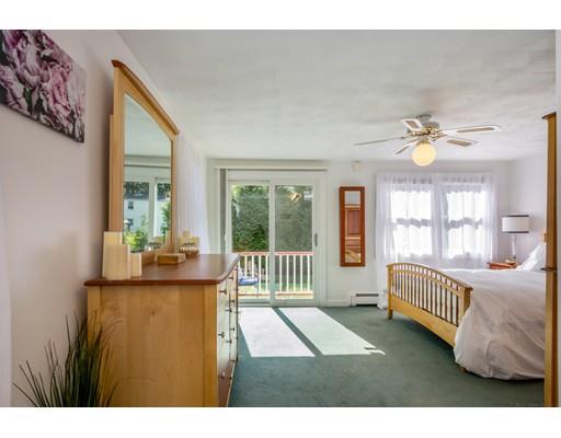 68 Harding Road Lexington, MA 02420 - Photo 23 of 41 a living room with a bed furniture and a large window