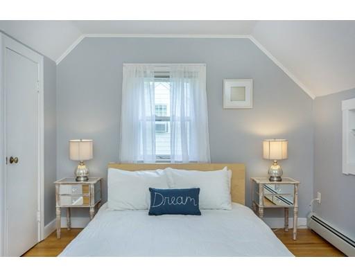 68 Harding Road Lexington, MA 02420 - Photo 24 of 41 a spacious bedroom with a bed and a lamp