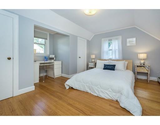 68 Harding Road Lexington, MA 02420 - Photo 25 of 41 a bedroom with a bed and wooden floor
