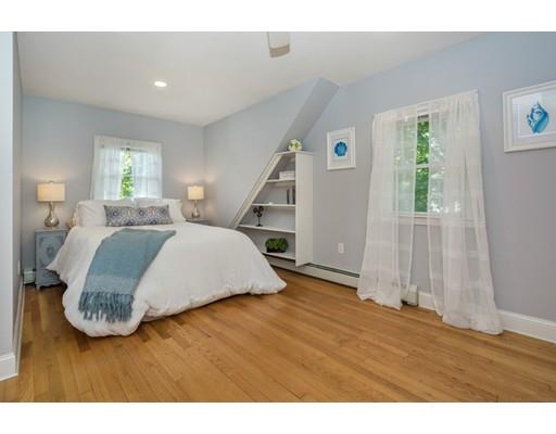 68 Harding Road Lexington, MA 02420 - Photo 27 of 41 a bedroom with a bed and wooden floor