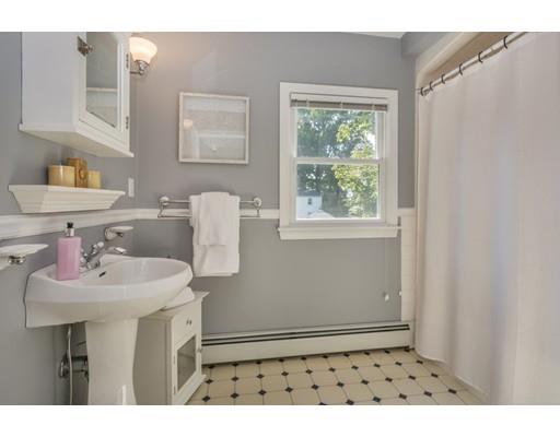 68 Harding Road Lexington, MA 02420 - Photo 30 of 41 a bathroom with a sink a mirror and a window